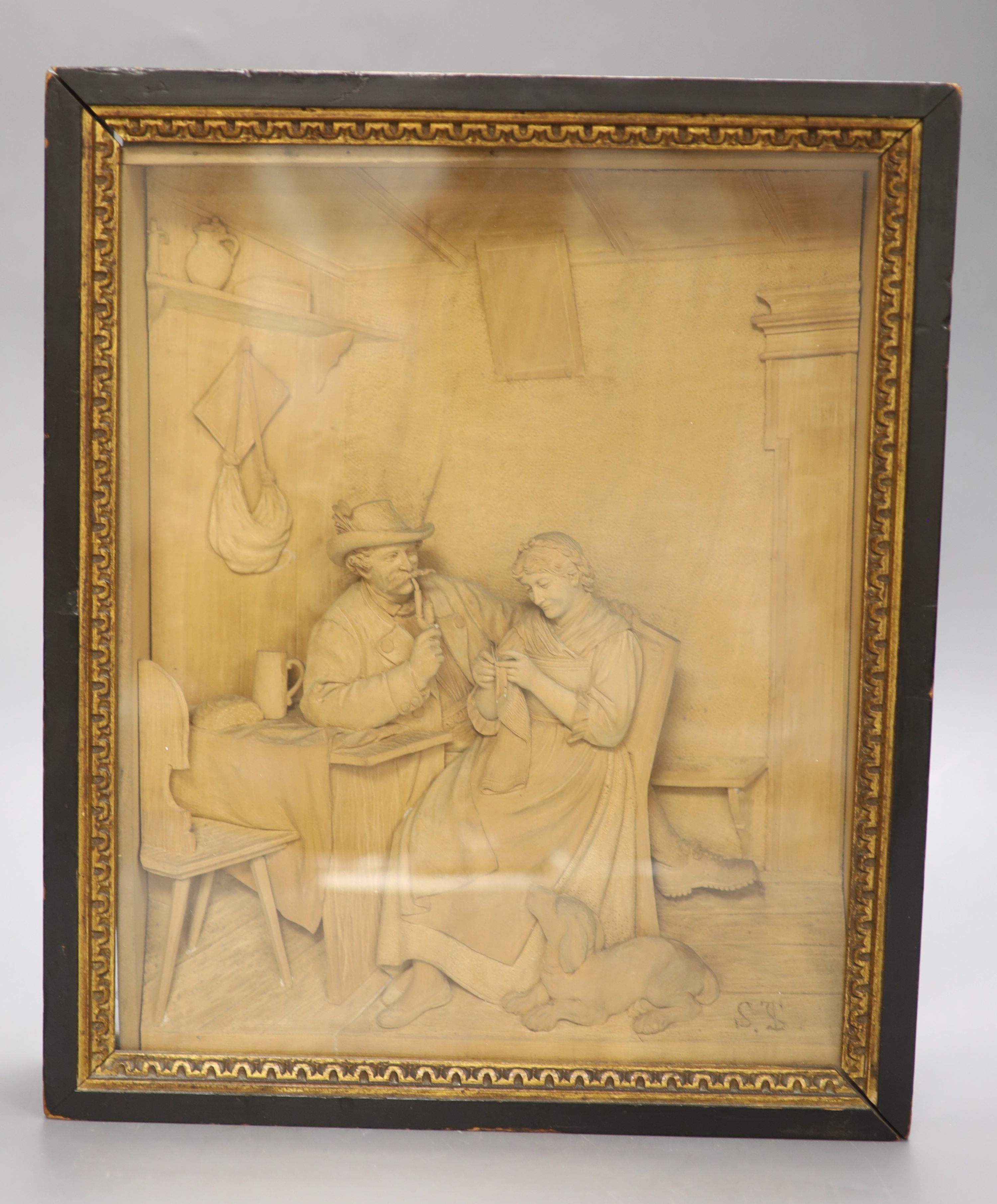 A 19th century Black Forest carved linden or limewood interior scene, 22 x 28cm